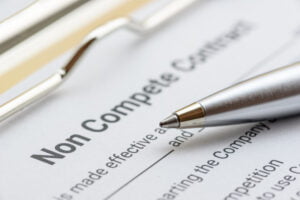 non compete contract on a clipboard